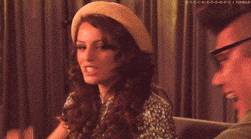 Celebrity gif. Cher Lloyd pumps her fist and looks at us intensely and excitedly, saying, "yes."