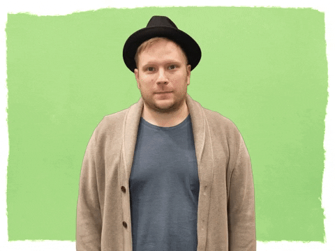 Celebrity gif. A hopeful Patrick Stump from Fall Out Boy crosses both fingers in anticipation.