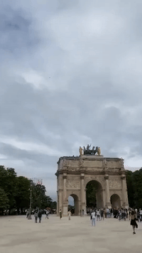 Paris Crowd Cheers Air Force Flyover During Scaled-Down Bastille Day Celebrations