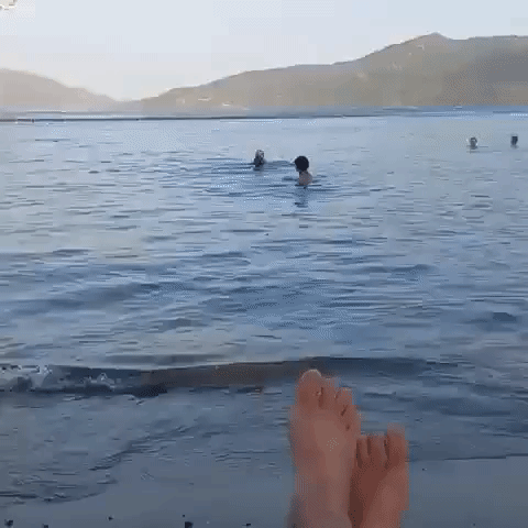Tourists Swim Along Turkish Coast as Helicopters Fight Encroaching Fires