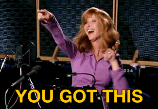 TV gif. Lisa Kudrow as Valerie Cherish on the Comeback dances in a recording studio. She points her fingers up in the air and has a big smile on her face. 
