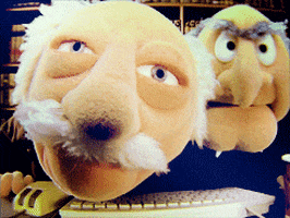 Muppets gif. Old men Statler and Waldorf give into the monitor of an old school computer.