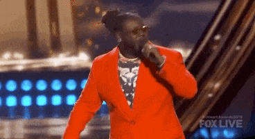 iheartradio music awards red suit GIF by iHeartRadio