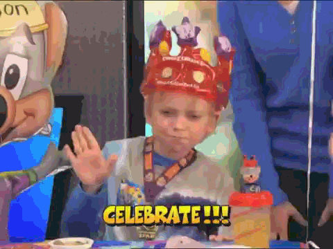 A child wearing a festive crown, raising his hand in celebration, with the word "Celebrate" displayed at the bottom, symbolizing the joy of success in JavaScript development.