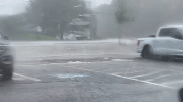Car Stranded in Floodwaters in Rhode Island Amid Torrential Rainfall