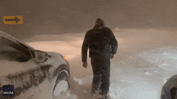 Man Trudges Through 'Near-Blizzard Conditions