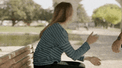 TV gif. Mélanie Maudran as Claire in Un Si Grand Soleil. She's sitting on a bench and is turned away from us. She slumps forward and puts her head in her hands, giving up.