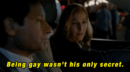 TV gif. David Duchovny as Fox Mulder and Gillian Anderson as Dana Scully sit in a car together. Fox shakes his head with a serious expression on his face as he says, “being gay wasn't his only secret.”