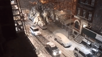 Cars Stuck on Snow-Covered Streets in New York City Amid Storm Chaos