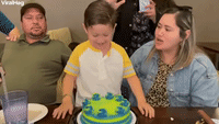 Kid Smashes Face into Birthday Cake 