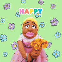 Video gif. Sunnie Dee, a puppet with medium brown fur and short blonde hair, wearing a pink tulle dress and holding a bouquet of yellow flowers against a lime green background with pulsing flowers. She looks at us with a smile, bobbing her head from side to side and says, "Happy birthday!" which appears in rainbow-colored text. 