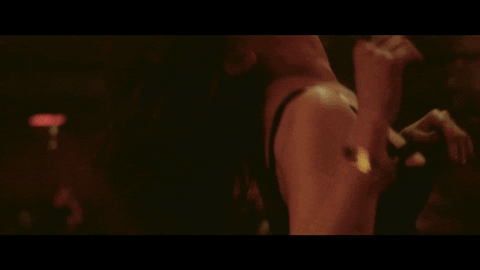music video hair flip GIF