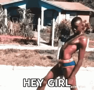 Video gif. Text, “Hey Girl.” A slim man wearing only super short shorts, ankle socks, and roller blades skates down the street. His legs are spread hard apart and his back is arched back. He looks like he thinks he’s cool and sexy, but it’s definitely not coming off that way. 