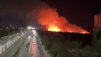 Fire Breaks Out Between Building and Highway in Noida