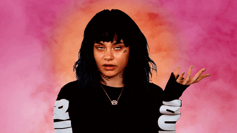 Celebrity gif. Kehlani moves her hand in front of her, rolls her eyes, and just her head out annoyed.