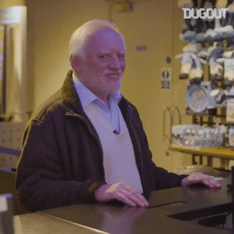 Meme gif. Hide the Pain Harold stands at a counter and turns his face toward us, pops his eyebrows and smiles as if he's trying very hard to seem okay.