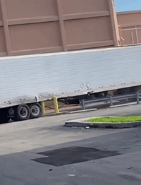 Semi-Truck Loses Back Wheels Trying to Turn