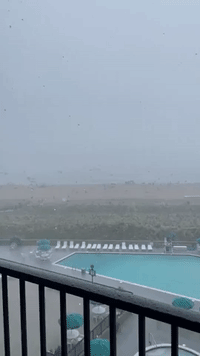 Beach Umbrellas Blown Into the Ocean as Severe Weather Hits Coastal Delaware
