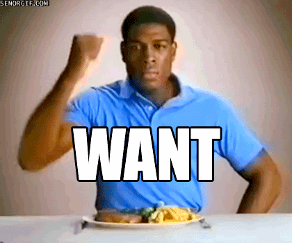Video gif. Man pounds his fist on a table with a plate of food in front of him. Text reads, "Want."