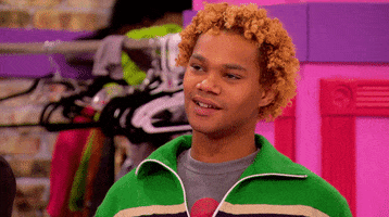 Reality TV gif. Chi Chi DeVayne on RuPaul's Drag Race is giving a catty raised eyebrow and smirk.