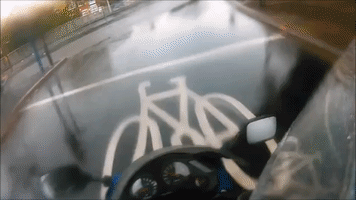 Motorcyclist Tips Over at Roundabout