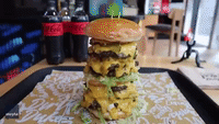 Competitive Eater Wolfs Down Whopping 8,000-Calorie Cheeseburger in Under 5 Minutes