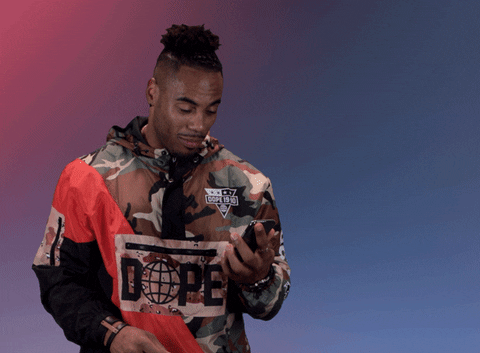 Sports gif. Rashad Jennings from the NFL looks down at his phone before looking back at up us with a wide eyed, clear expression and says, "Noted!" with a big nod and resumes scrolling on his phone.