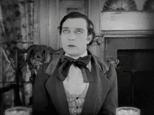 Movie gif. Buster Keaton as Willie McKay in Our Hospitality rolls his eyes dramatically.