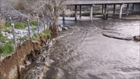 Normally Dry Creek Bed Floods as Rain Affects California