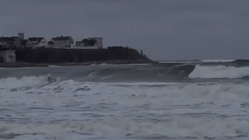 Surfers Brave Winter Cold to Catch Waves in Hampton, New Hampshire