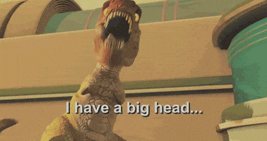 TV gif. The T-Rex in Meet The Robinsons, looks down with his large dinosaur head. He holds his short front arms away from his body and waves them. Text reads, "I have a big head... and little arms."