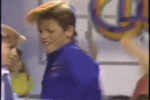 Meme gif. Blonde boy Duane from Barbie Dance Club movie doing a Soul Train-like dance down a line of other kids. 