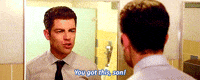 TV gif. Wearing a white shirt and tie, Max Greenfield as Schmidt from New Girl aggressively psyches himself up in the bathroom mirror. Text, "You got this, son!"