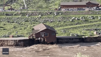House Falls Into River Amid Major Flooding