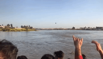 Helicopter Flies in to Rescue People in Tigris River Following Fatal Ferry Disaster