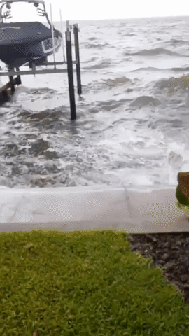 Waves Crash Over Breakwater in Florida Amid Continued Tropical Storm Elsa Warnings
