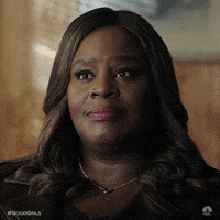 TV gif. Closeup of Retta as Ruby in The Good Girls as she tilts her head, purses her lips, and rolls her eyes to the side.