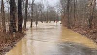 Debris Swept Through Rushing Floodwater in Kentucky