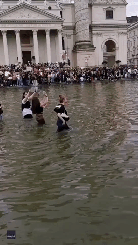 Protesters at Massive Vienna Demonstration Trek Through Water Near Karlskirche