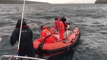 Coast Guard Rescues Migrants Aboard Raft Off Turkey
