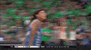 Sports gif. Seimone Augustus from the WNBA Minnesota Lynx is taunting someone on the court, sticking her tongue out and nodding her head.