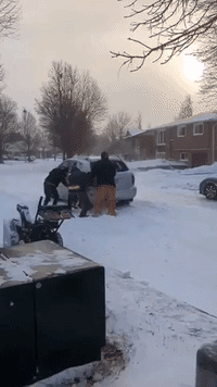 Ontario Residents Help Car Stuck on Snowy Road
