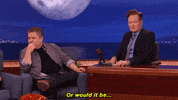 Celebrity gif. A serious Conan O'Brien sits with guest Patton Oswalt who turns inquisitively and says, “or would it be…amazing,” with emphasis on amazing.