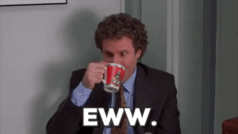 Movie gif. Will Ferrell as Buddy in "Elf" wearing a suit and tie, drinking from a coffee mug and grimacing with disgust. Text, "Eww."