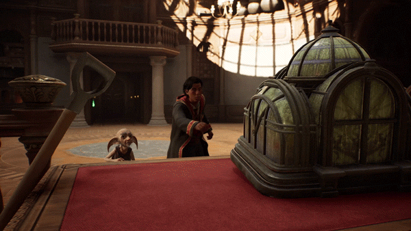 TechDogs-"Introduction"-"A Hogwarts Legacy character points at a glass display in a grand room eventually changing room dynamics." TechDogs-"Introduction"-"A Hogwarts Legacy character points at a glass display in a grand room eventually changing room dynamics."