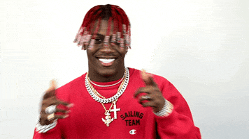 Celebrity gif. Lil Yachty grins and points at us with both fingers.