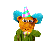 Sticker gif. Fuzzy puppet bear with big furry cyan blue ears pops up and blows a party horn at us. It has a bow tie on and a rustic green blazer.