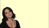 Celebrity gif. Becky G points her fingers up and then spreads them out in an arching as she says, “Whatever.” She then looks at us with a big smile. 