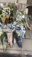 Mourners Lay Flowers Outside British Consulate in Hong Kong