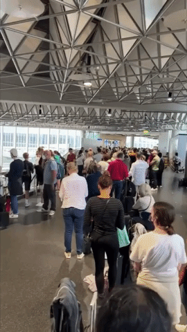 Passengers Wait in Long Lines in Frankfurt Airport